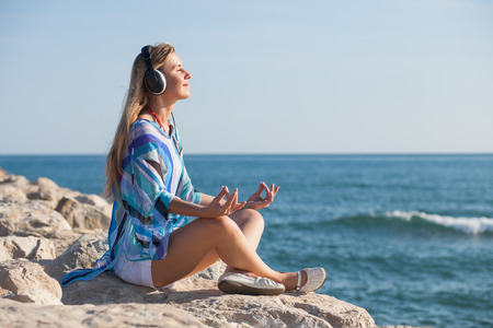 woman meditating at seacoast